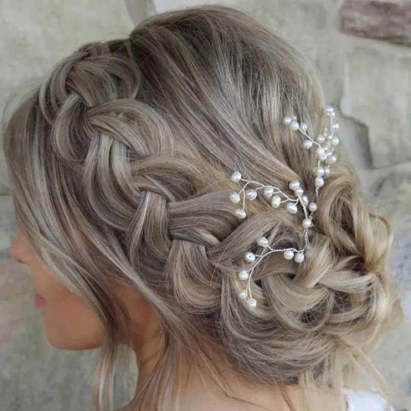Elegant braided up-do styled at Just Friends Hair Design